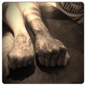 Hand tattoos. Jess' tattoo of Ganesha is on the left.