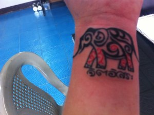 One of the two elephants in the ring around Raeah's wrist.